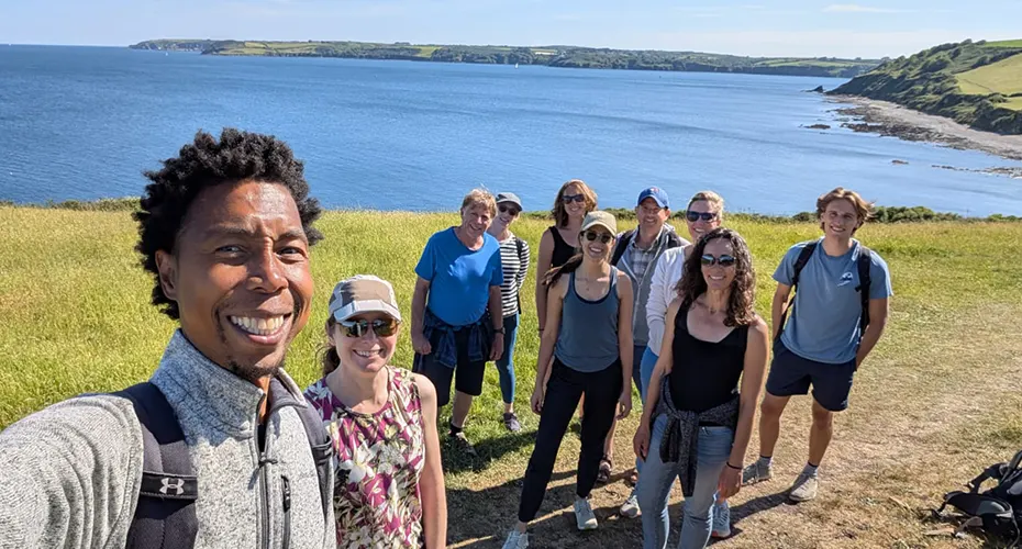 Workshop attendees by the coast