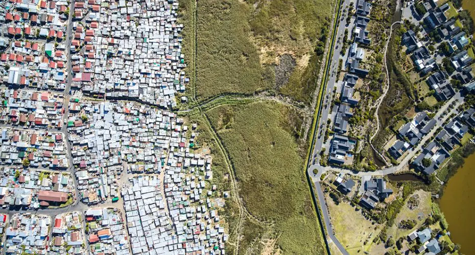 Aerial view of two residential areas with land between